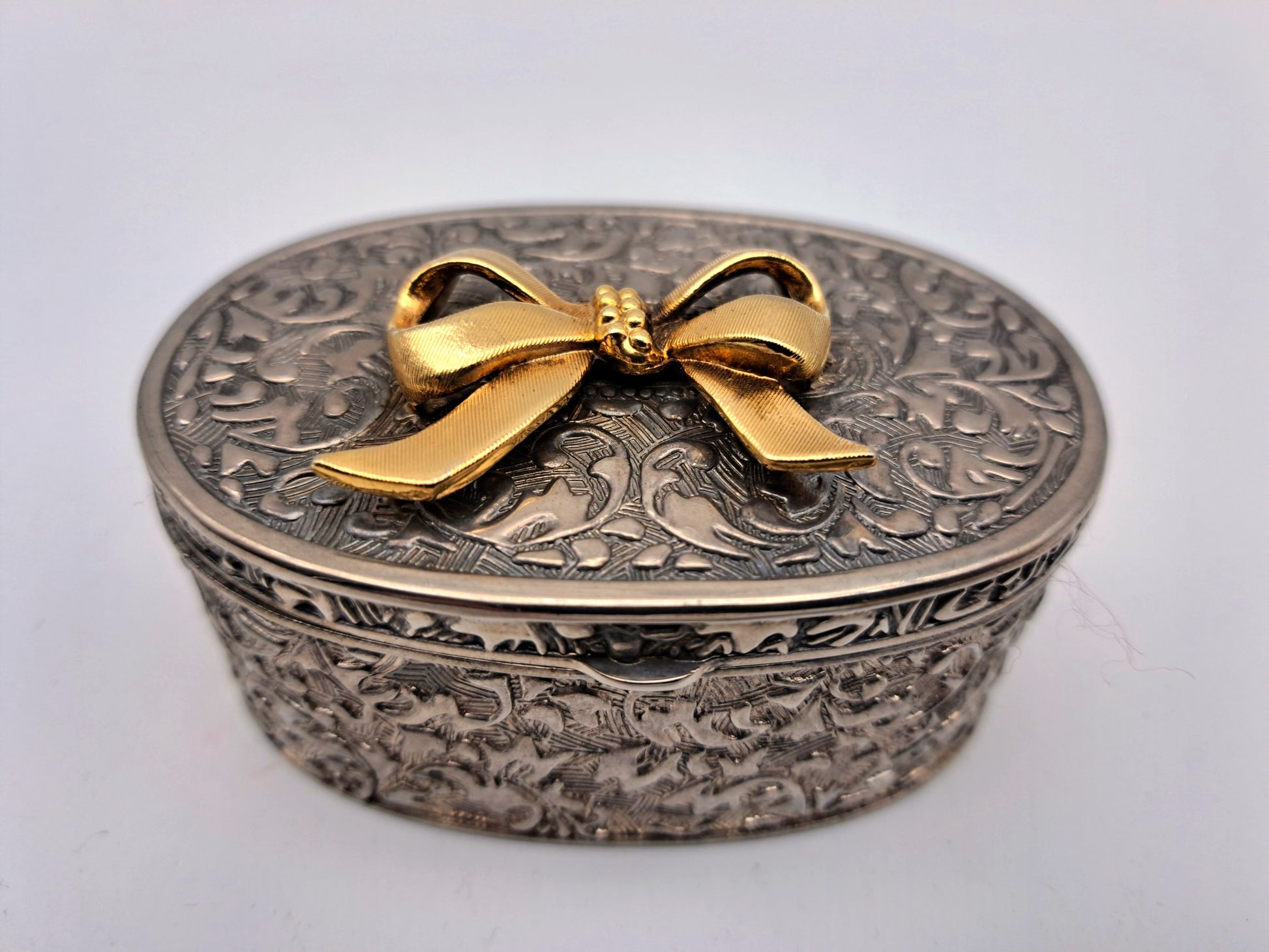 Vintage Silver Plated Oval Trinket Box with Gold Tone Bow Accent